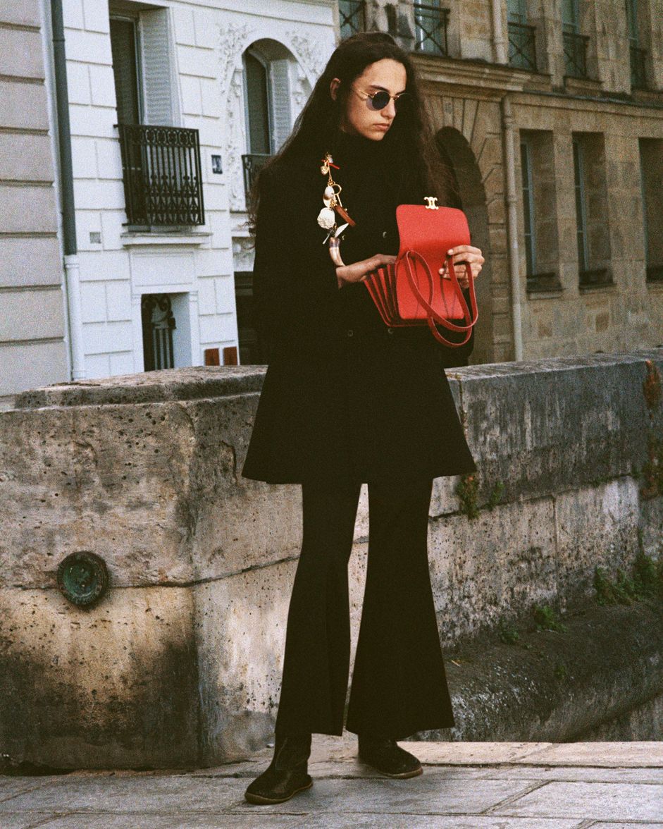 Discover the red CELINE 17 bag styled with an all-black look.
