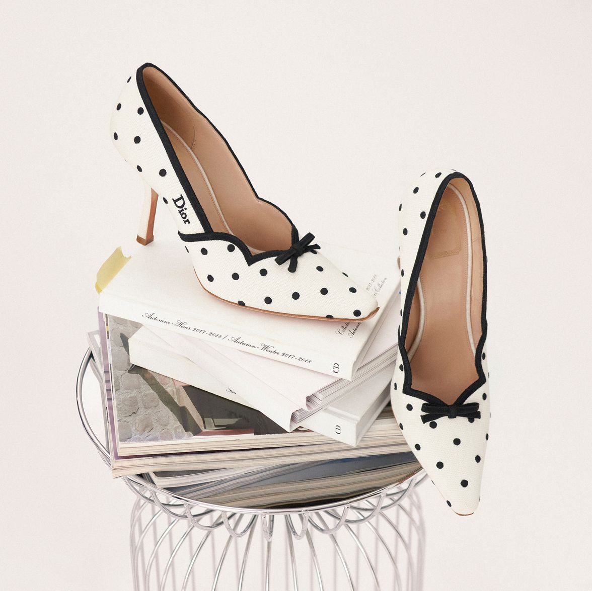 Discover Dior Romance pumps, featuring a feminine polka-dot design, showcasing the House's signature style.